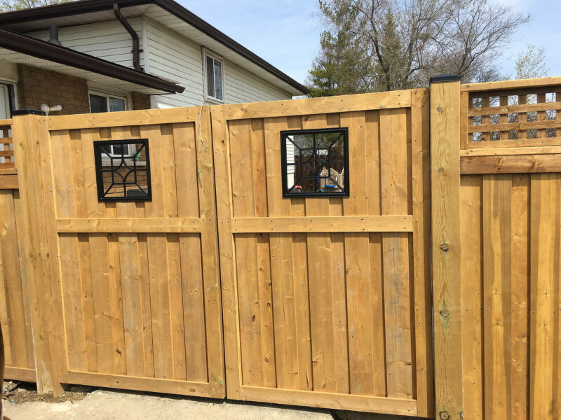 Double wood gates with diamond iron inserts.
