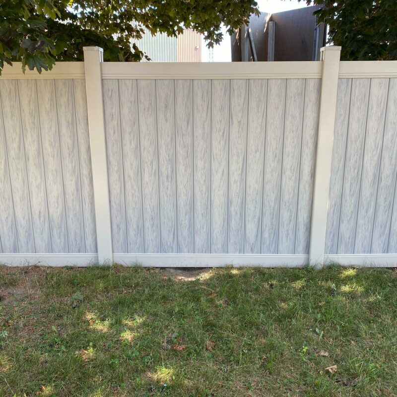 Faux wood vinyl fence