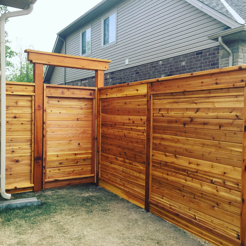 Stained Horizontal Wood Fence With Gate