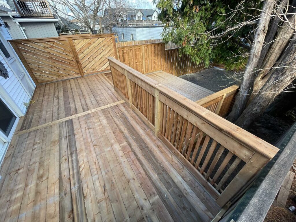 Overview Photo of Wood Deck With Railings And Fence