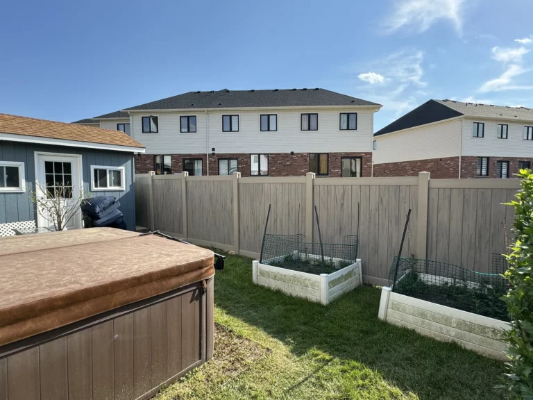 Residential backyard with vinyl fence