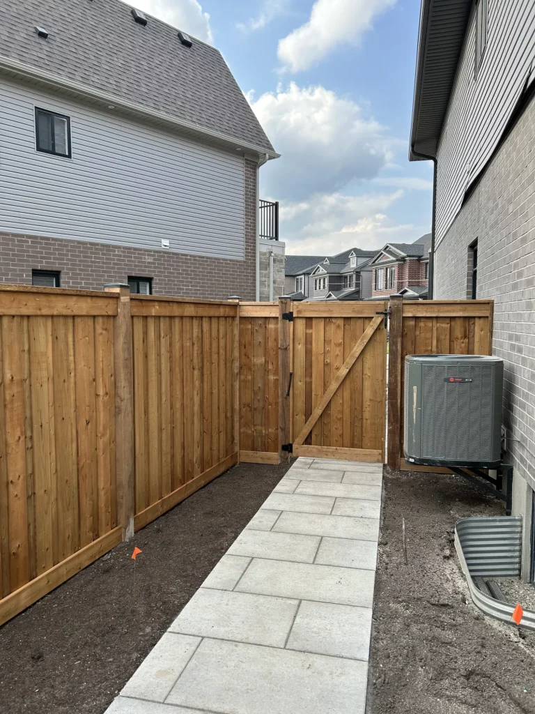 Wood Fence With Gate Between Houses
