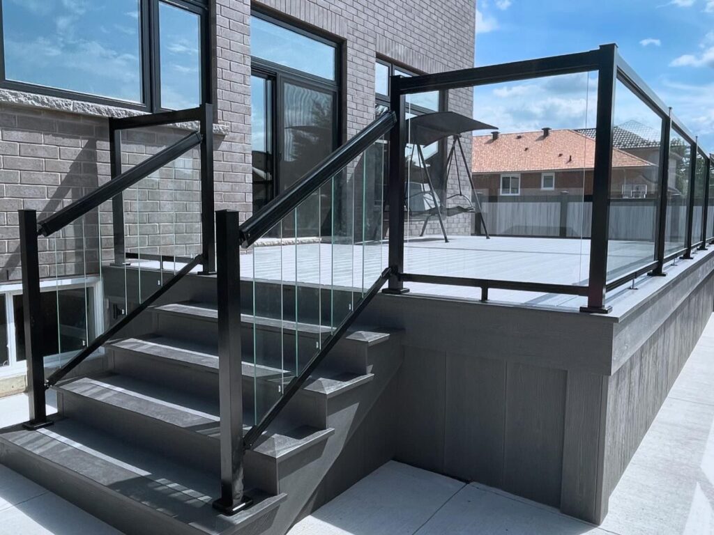 Black Aluminum Railing With Glass System On Composite Deck