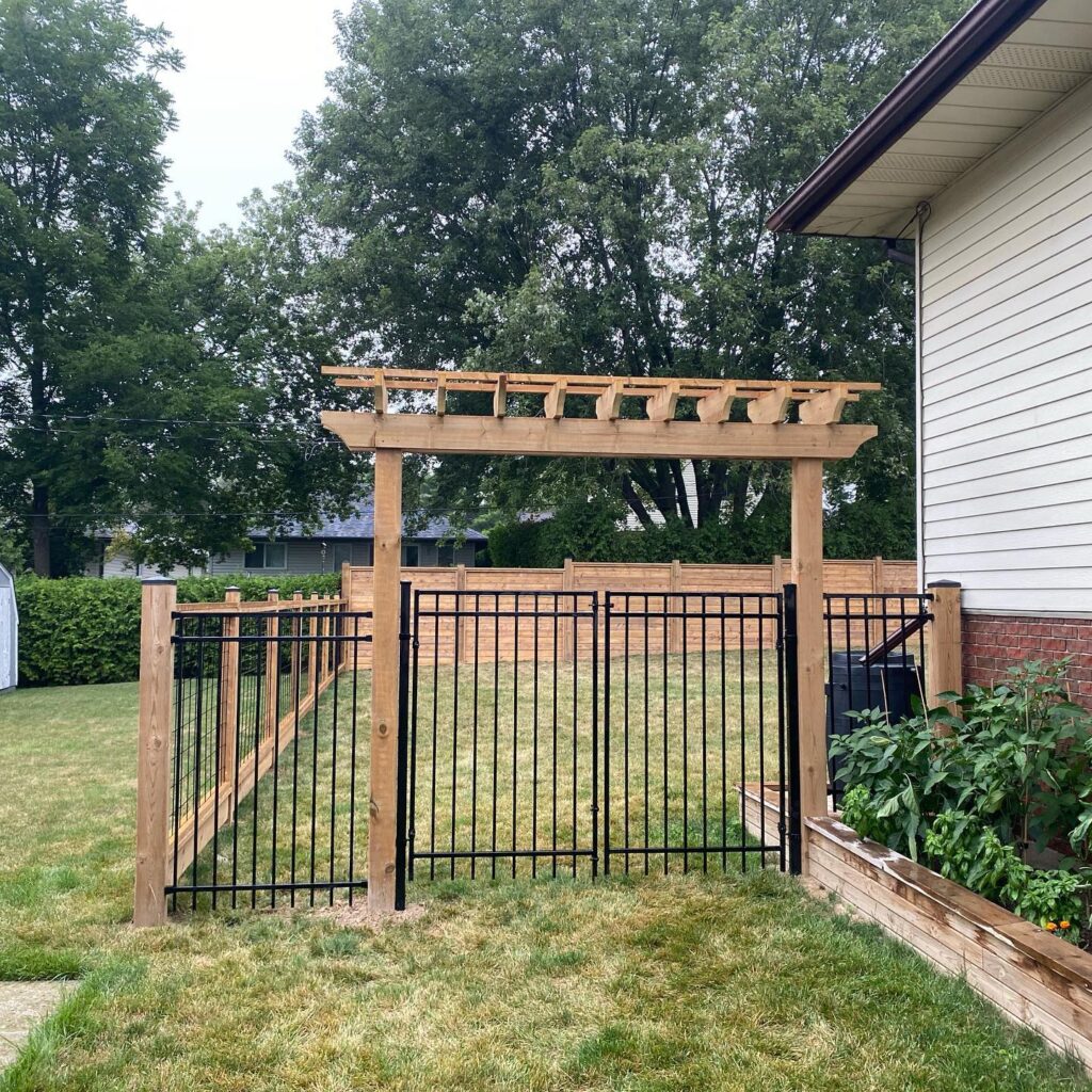 Double iron gate with custom wood arbour