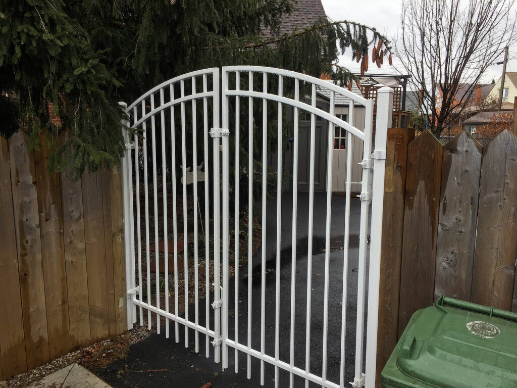 Arched white iron gate
