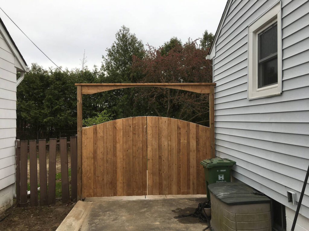 Arched double wood gate and arbour