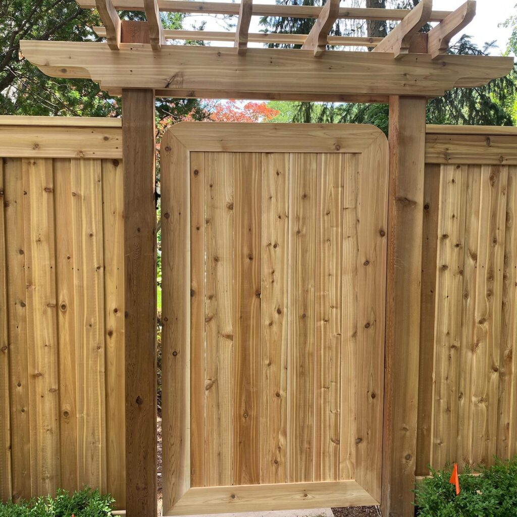 Cedar gate with custom arbour