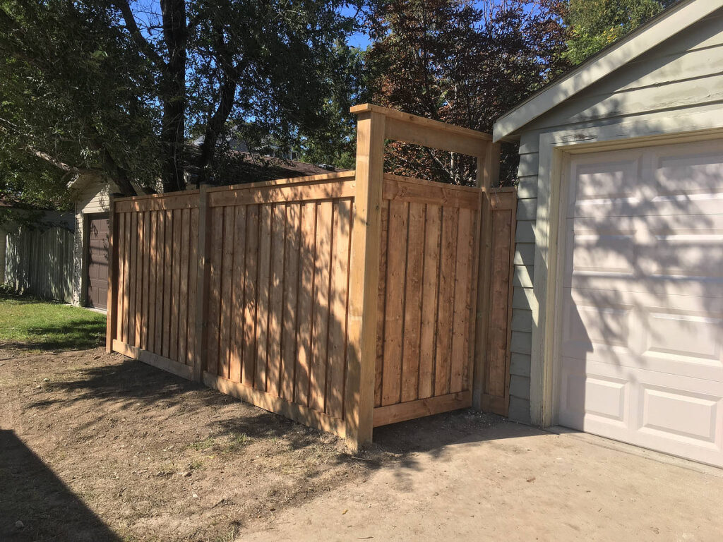 Wood privacy gate and arbour attached to garage