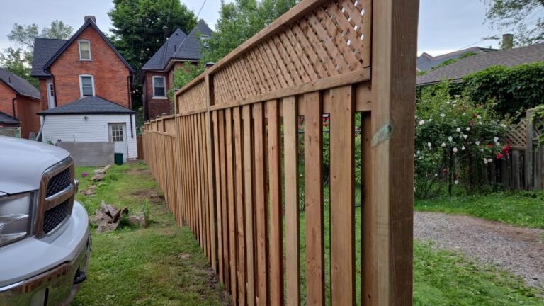 good neighbour wood fence with lattice top and post caps