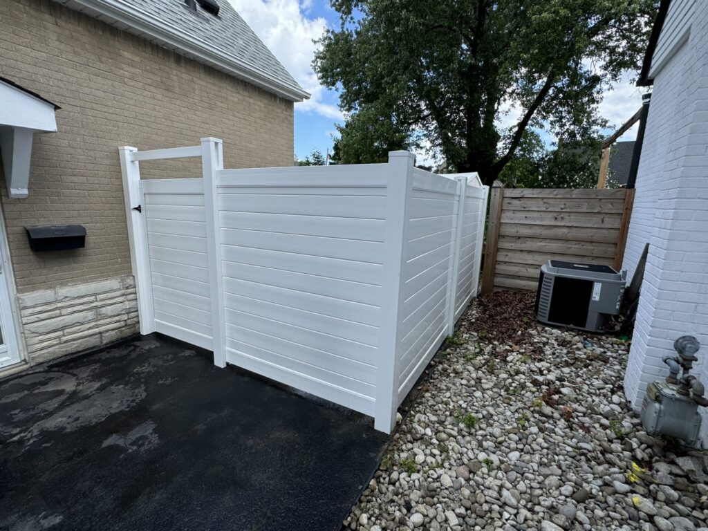 Horizontal white vinyl fence and gate
