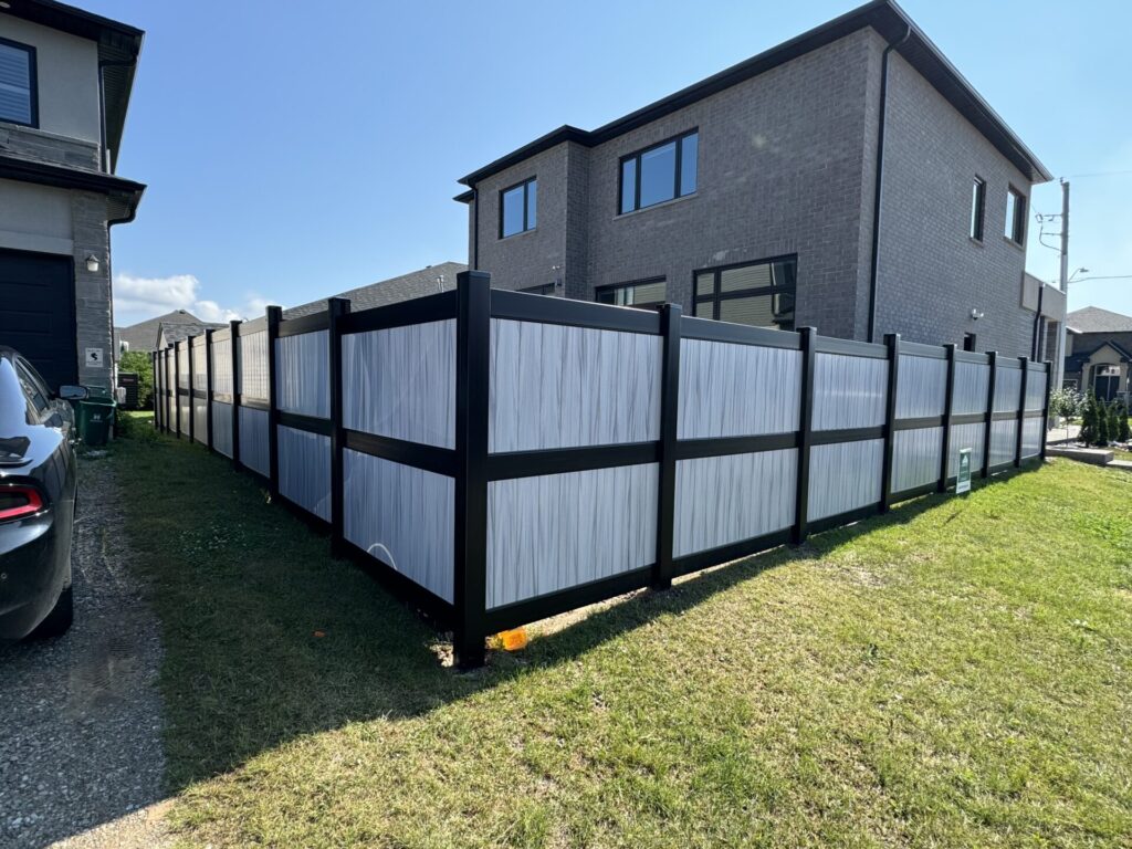 Supernova coloured vinyl fence with black 3 rail system and posts