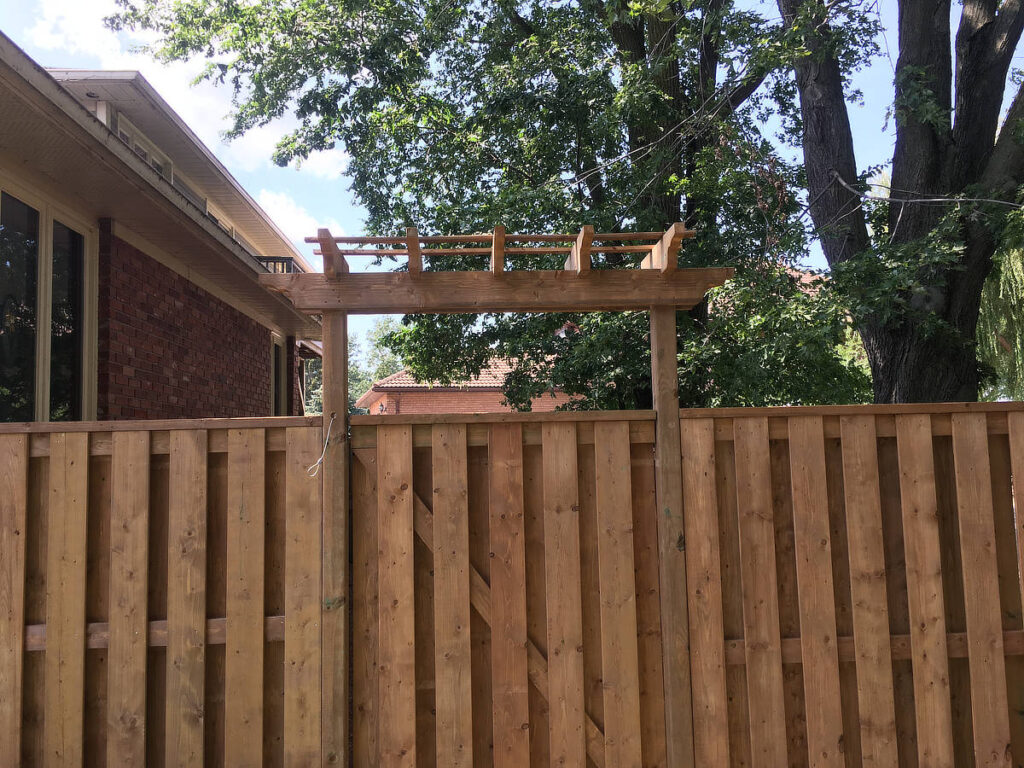 Privacy wood gate boards on both side and top beam arbour