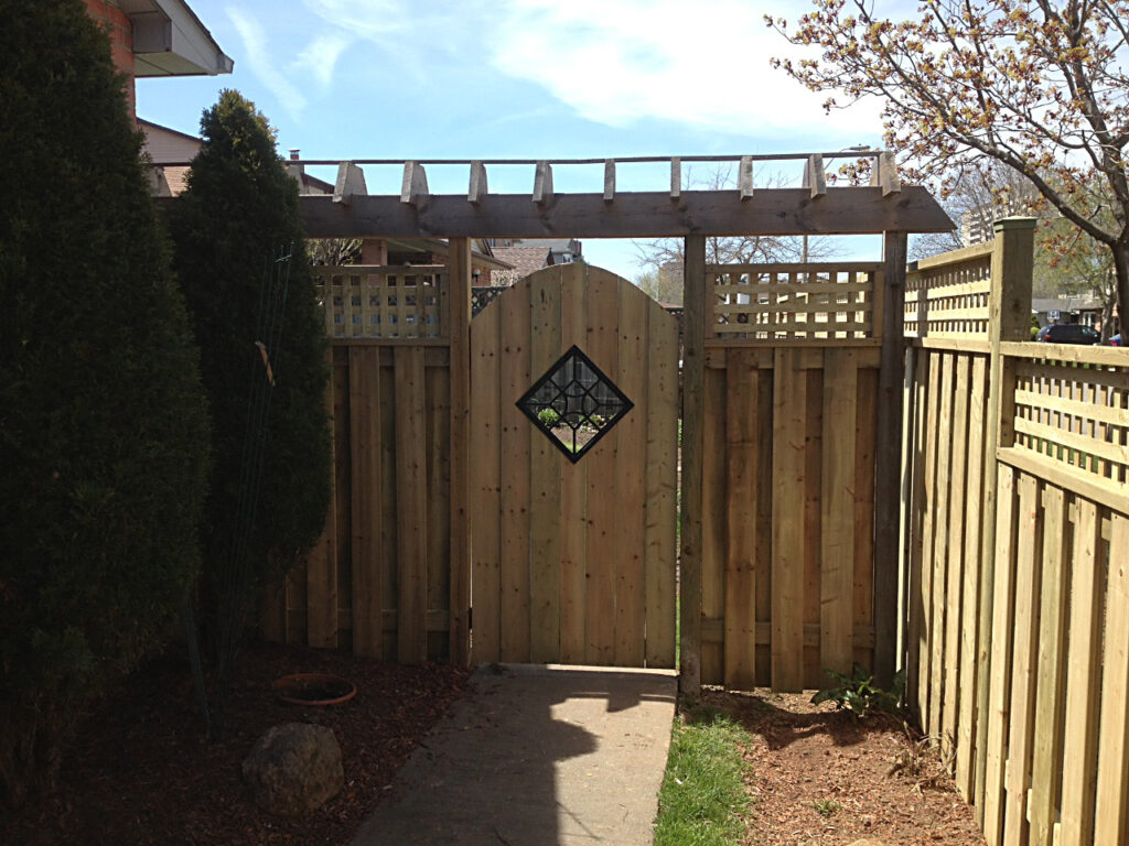 Wood gate and custom arbour with an iron insert