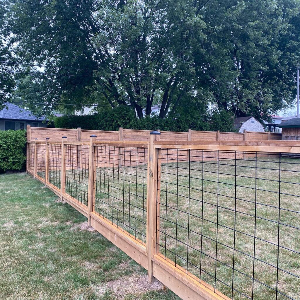 wood and wire backyard fence along with a horizontal wood privacy fence
