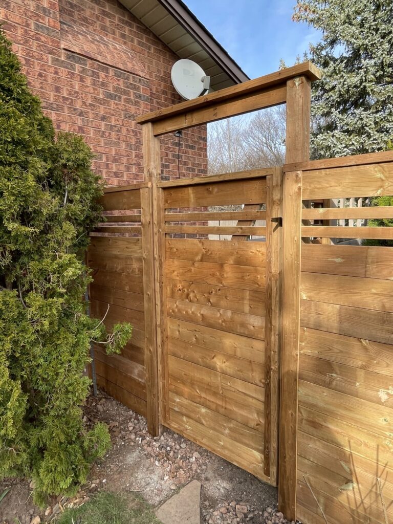 Custom slate designed horizontal wood fence and arbour